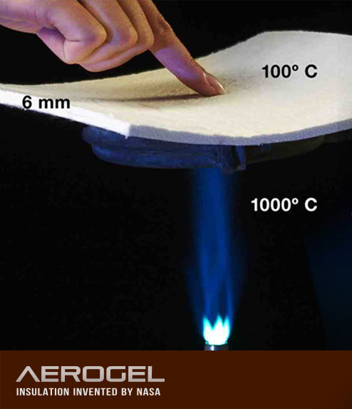 A hand presses down on a piece of aerogel insulation material, with the top surface labeled 100°C and a flame underneath labeled 1000°C. The material is 6 mm thick. Text at the bottom reads AEROGEL INSULATION INVENTED BY NASA.