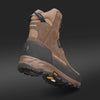 A close-up of HILLMAN Insulated Hunting boots Aerogel™3-Season, featuring brown and black design, highlights the detailed sole and tread pattern against a dark gradient background, emphasizing their durability for outdoor use.