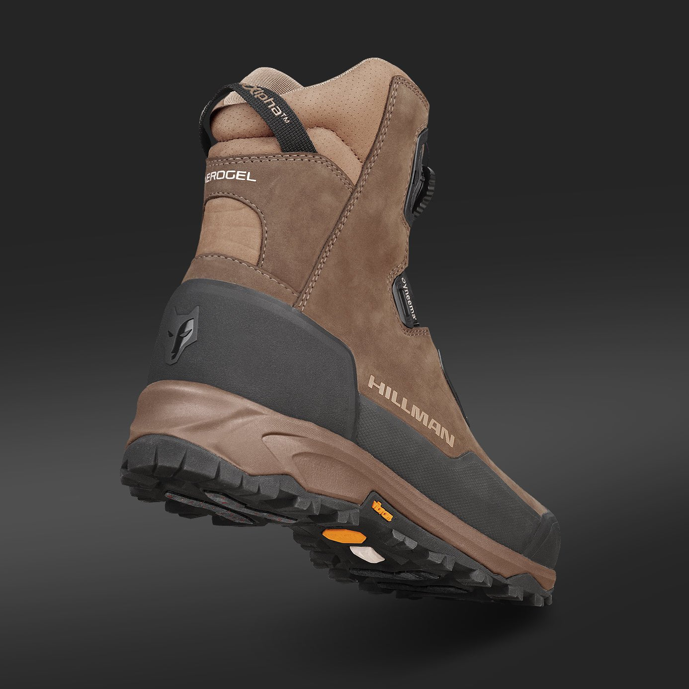 A close-up of HILLMAN Insulated Hunting boots Aerogel™3-Season, featuring brown and black design, highlights the detailed sole and tread pattern against a dark gradient background, emphasizing their durability for outdoor use.