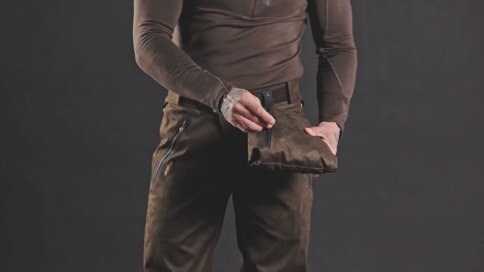 Load video: packable camo hunting jacket